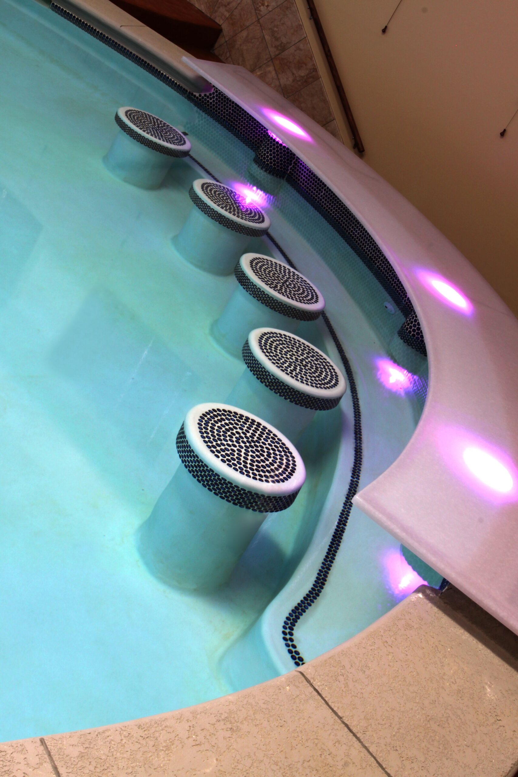 Path and wall lighting around pool