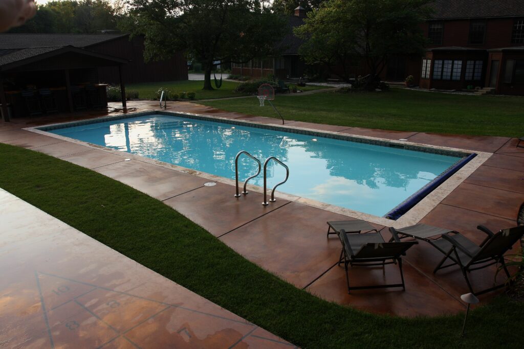 Aquarius pool project with a warm-toned decorative concrete patio